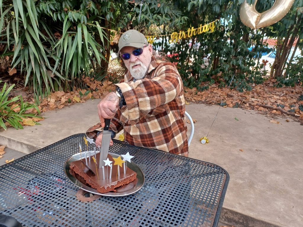 Man cutting cake